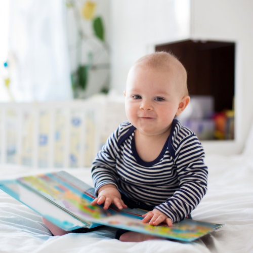 Infant reading a book